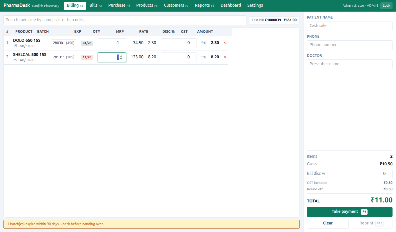 The billing screen with items in the cart, each showing its batch and expiry.
